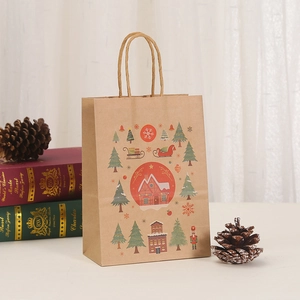 Christmas kraft paper gift bag with festive reindeer and snowflake prints and rope handle