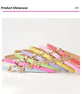 Close-up of candy-colored skinny belts with butterfly charms and golden buckles