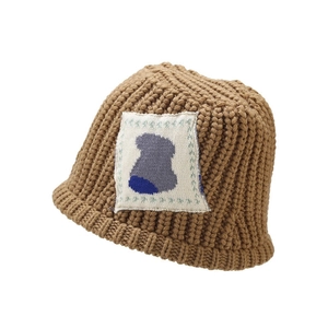 Brown knit bucket hat for women with chunky weave texture and minimalist white patch detail