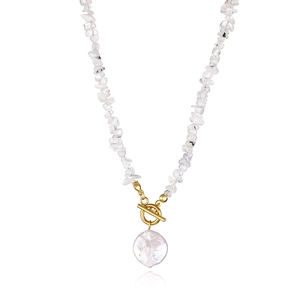 Detail of baroque pearl pendant and irregular gemstone beads with golden OT clasp