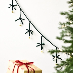 Vintage green velvet Christmas bow garland with gold bells for holiday tree decoration