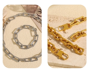 Detailed view of rectangle link chain jewelry set and lobster clasp in gold and silver