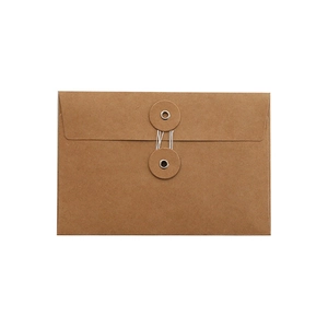 Vintage brown kraft paper envelope with string tie closure for stationery storage