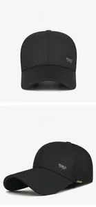 Detail view of black baseball cap with golden metal Sports Style plate and stiff crown