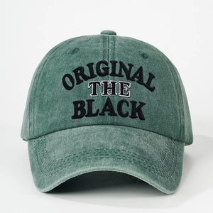 Close-up of ORIGINAL black embroidery on vintage green washed cotton baseball cap