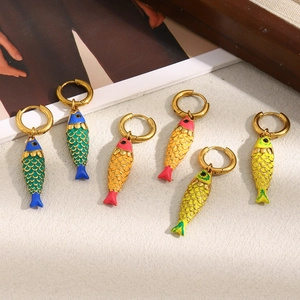 Detail of colorful fish drop earrings in blue orange and yellow with 18K gold plating