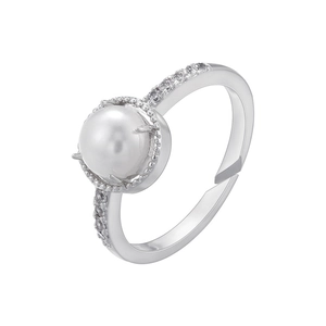 Detail of adjustable silver ring featuring a central white pearl and pavé set cubic zirconia