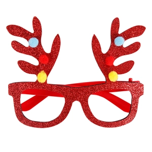 Detail of red glitter reindeer antler glasses with colorful pom-poms for Christmas party