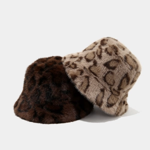 Winter plush faux fur leopard bucket hats in brown and beige tones with a fluffy texture