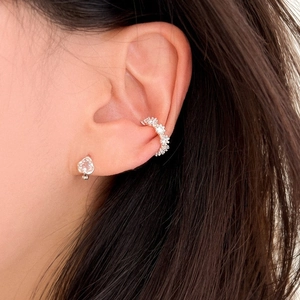 Silver heart stud earring and sparkling cubic zirconia ear cuff set on female model
