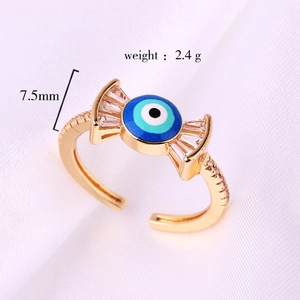 Macro detail of gold evil eye ring with colorful cubic zirconia and a weight of 2.4g
