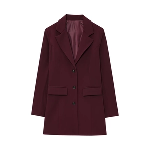 Detail of burgundy blazer featuring single-breasted three-button closure and flap pockets
