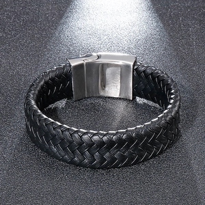 Close-up of black braided leather bracelet with silver stainless steel clasp detail