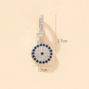 Detailed view of silver evil eye pendant with blue and white zircon, size 2.7cm by 1.2cm