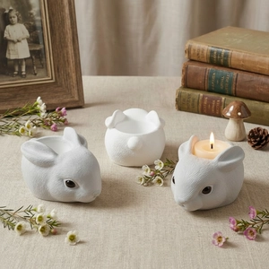 Three rabbit shaped resin candle holders with matte texture for Easter DIY home decor