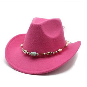 Close-up of ethnic decorative band with shells and beads on pink felt cowboy hat