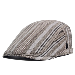 Close-up of the vintage striped cotton flat cap showing weave texture and retro patterns