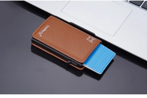 Detail of RFID-blocking lychee texture wallet with automatic pop-up card slider mechanism