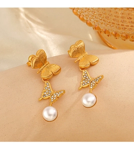 Detail of 18K gold plated butterfly earrings with sparkling zircon and white pearl drops