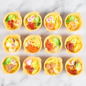 Set of 12 assorted miniature resin ramen noodle bowls with realistic toppings and yellow handles