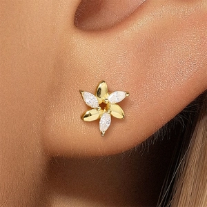 Macro view of dainty S925 silver flower stud earring with marquise zircon petals on ear