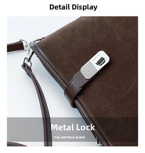 Detailed close-up of dark brown suede bucket bag with bright silver metal twist lock