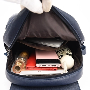 Blue leather texture backpack for women showing spacious interior with tablet and umbrella