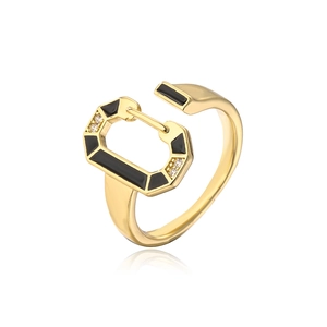 Macro detail of 18K gold plated earring with black enamel and sparkling crystals