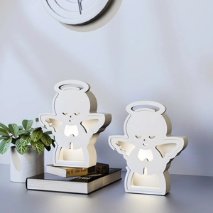 Minimalist LED angel figurines for DIY decor on books with warm ambient lighting