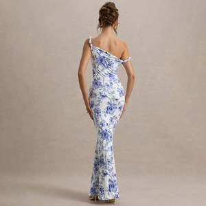 Detail of floral print maxi dress featuring one-shoulder design and slim mermaid silhouette