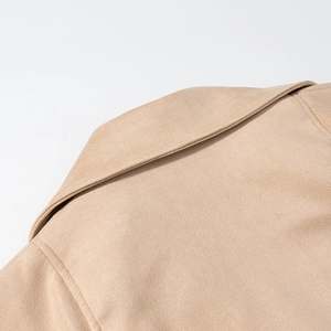 Close-up of the back neckline and shoulder seam on a light brown suede jacket