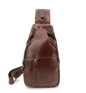 Detail view of brown vintage leather chest bag with zipper and stitching craftsmanship