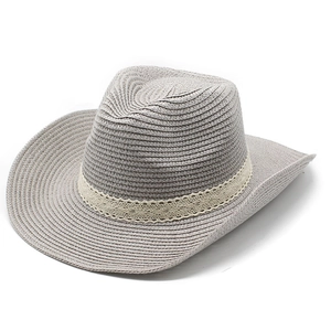 Detailed macro view of the grey straw fedora featuring a delicate white lace ribbon trim