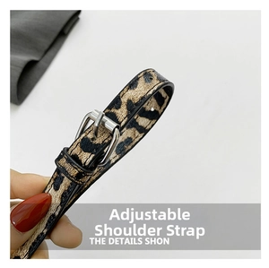 Detail of adjustable leopard print shoulder strap with polished silver metal buckle