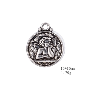 Detail view of 15x15mm antique silver round pendant with embossed angel pattern