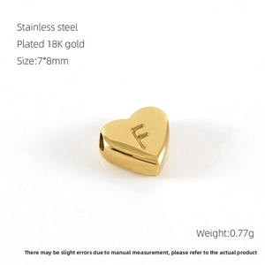 Detail showing letter F heart pendant in 18K gold plated stainless steel, 7x8mm size