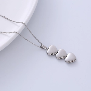 Elegant silver triple heart pendant necklace in polished stainless steel for women