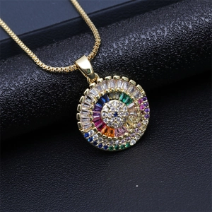 Macro detail of gold-plated evil eye necklace with colorful zircon pavé stones