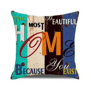 Macro detail of vintage wood grain pillow cover with HOME print and industrial texture