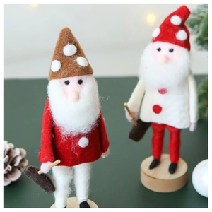 Detail of wool felt Santa Christmas figurines on natural wooden bases for festive decor