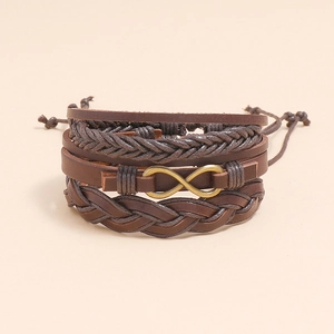 Close-up of brown multi-layer braided leather bracelet with golden infinity symbol buckle