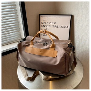 Khaki yoga fitness bag on a metal stool with waterproof nylon and yellow leather handles