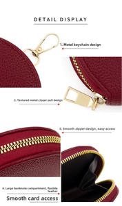 Macro detail of red litchi grain leather purse with golden metal zipper and keychain