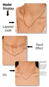 Detailed view of gold plated star pendant necklace with cubic zirconia on model