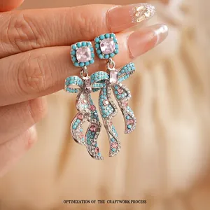 Boucles d'oreilles vintage avec nœud en zircon, cristaux roses et perles turquoise