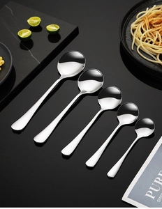 Five assorted sizes of thick 304 stainless steel spoons arranged on a premium dark table