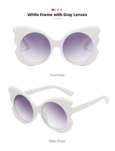 Vertical view of white butterfly sunglasses with gradient lenses and oversized frames