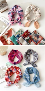 Detailed view of assorted floral cotton linen scarves with soft texture and elegant patterns
