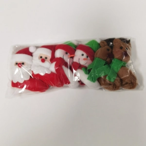 Three plush Christmas dolls including Santa Claus, Snowman and Reindeer in a clear gift bag
