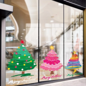 Three colorful Christmas tree window decals with Merry Christmas text for festive shop decor